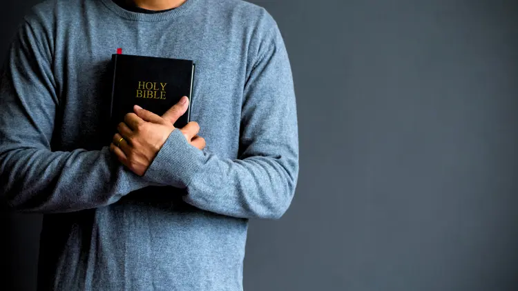 holding Bible